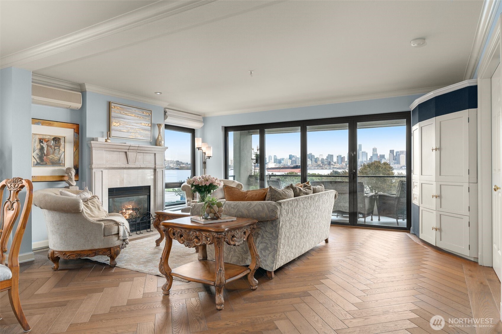 1333 Harbor Avenue Southwest, Unit 204 Seattle, WA 98116 - Photo 7 of 27 a living room with furniture a fireplace and a floor to ceiling window