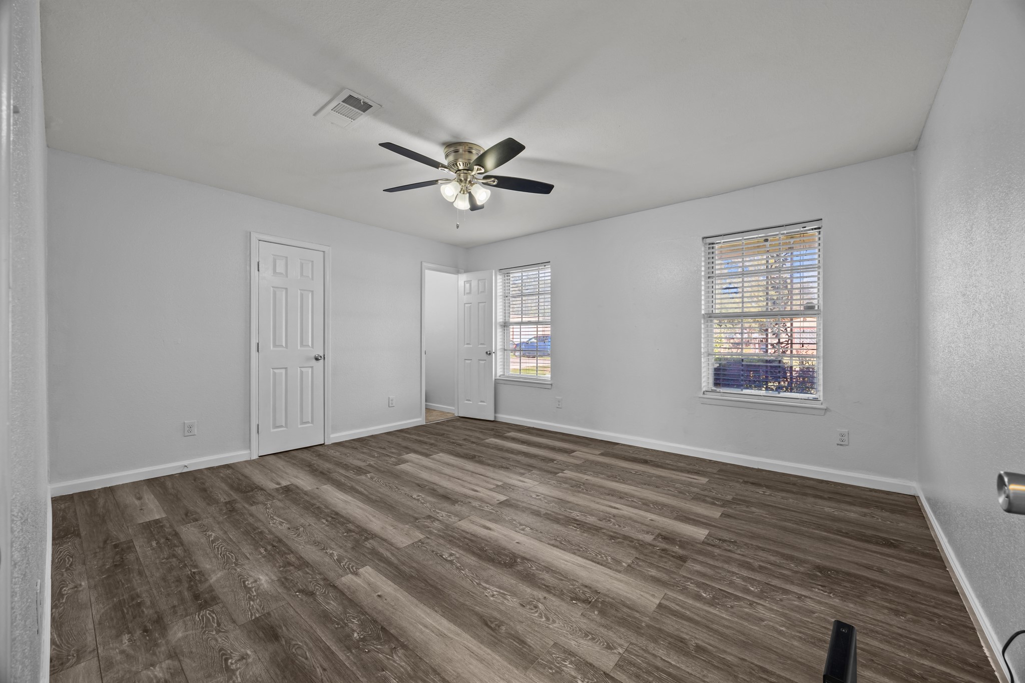 2103 6th Street Stafford, TX 77477 - Photo 13 of 27 a view of an empty room with a window