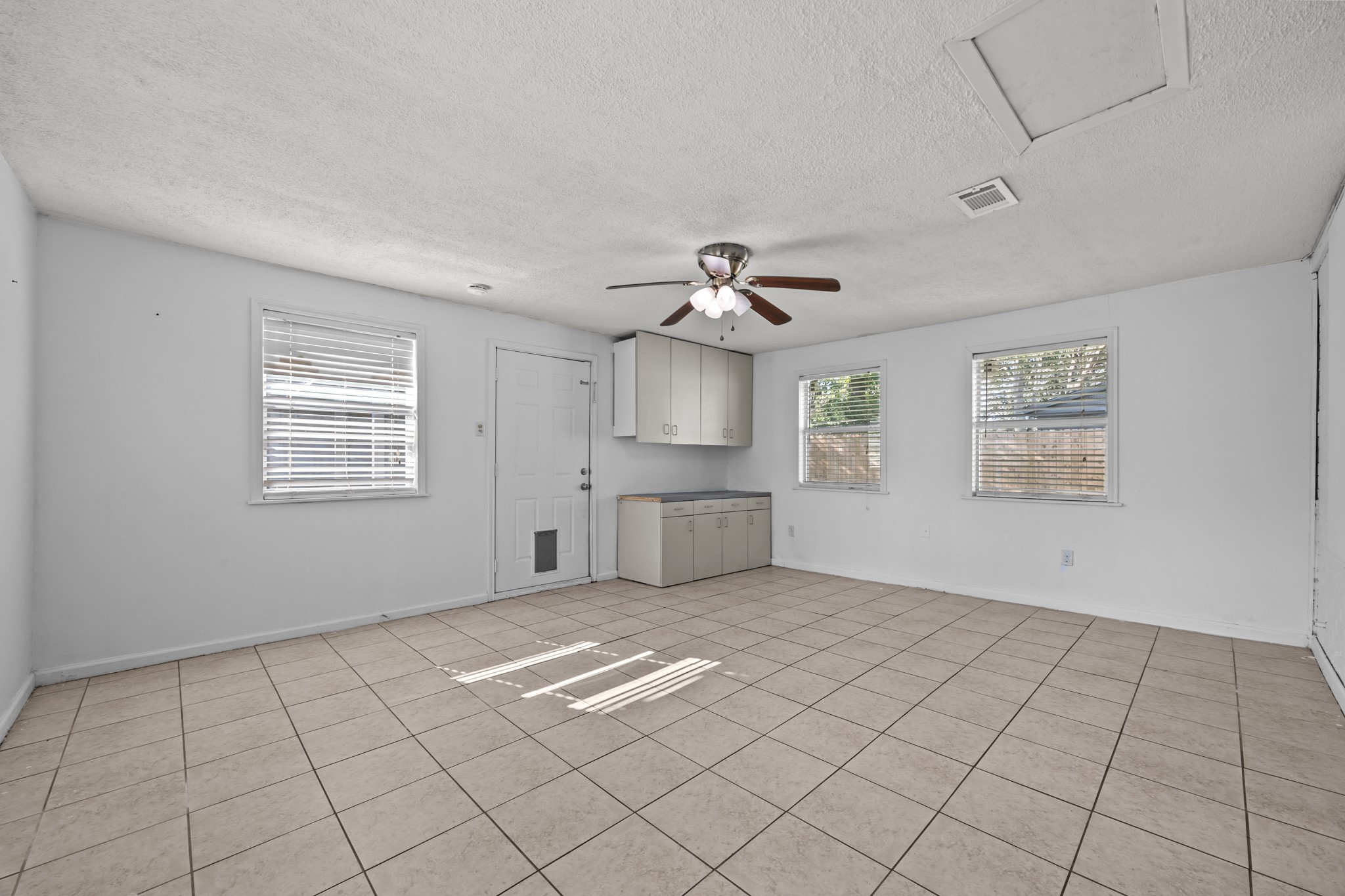 2103 6th Street Stafford, TX 77477 - Photo 10 of 27 a view of an empty room with a window