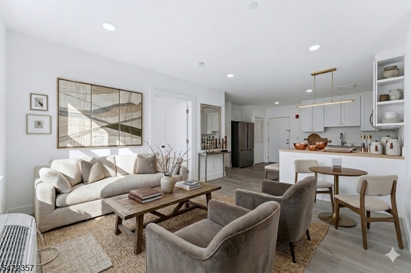 95 Shepherd Lane, Unit B307 Totowa, NJ 07512 - Photo 12 of 13 a living room with furniture and a large window