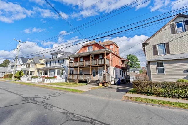 a front view of a building with street view