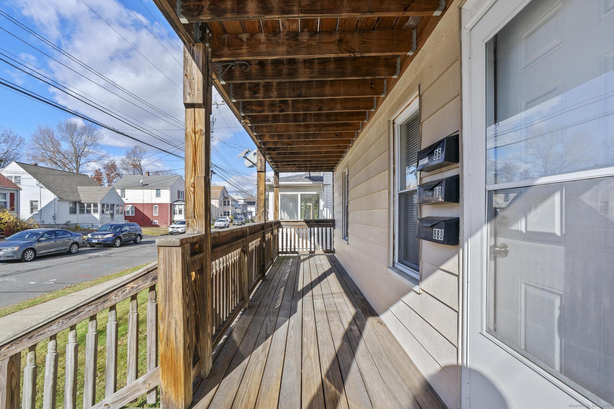86 Windsor Street Enfield, CT 06082 - Photo 15 of 35 a view of a balcony with wooden floor