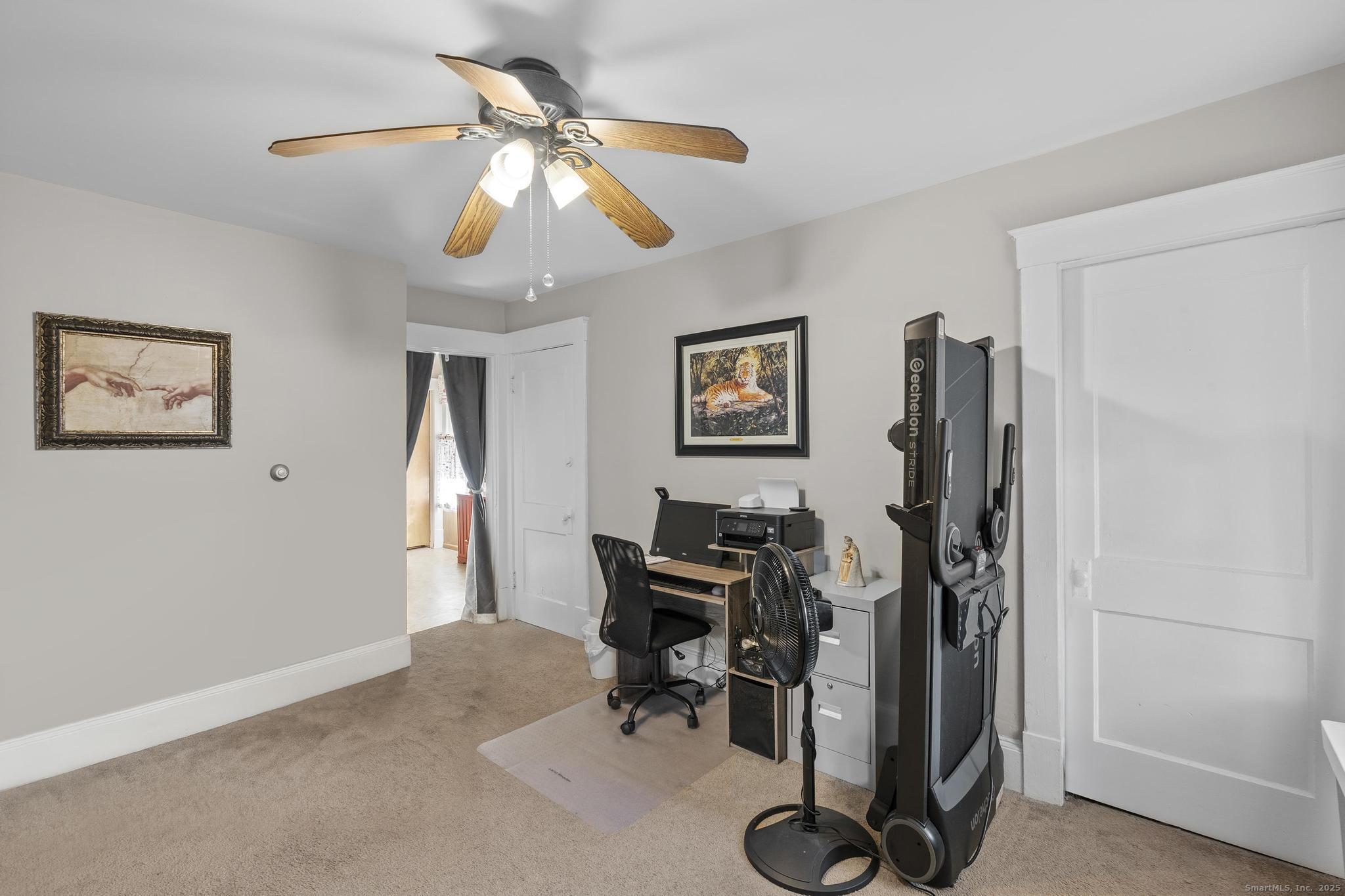 86 Windsor Street Enfield, CT 06082 - Photo 22 of 35 a view of a workspace with furniture and a window