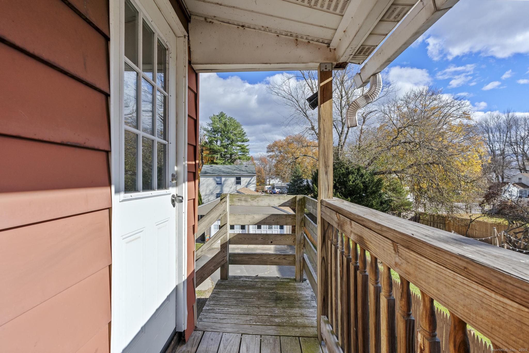 86 Windsor Street Enfield, CT 06082 - Photo 32 of 35 a view of a balcony with wooden floor