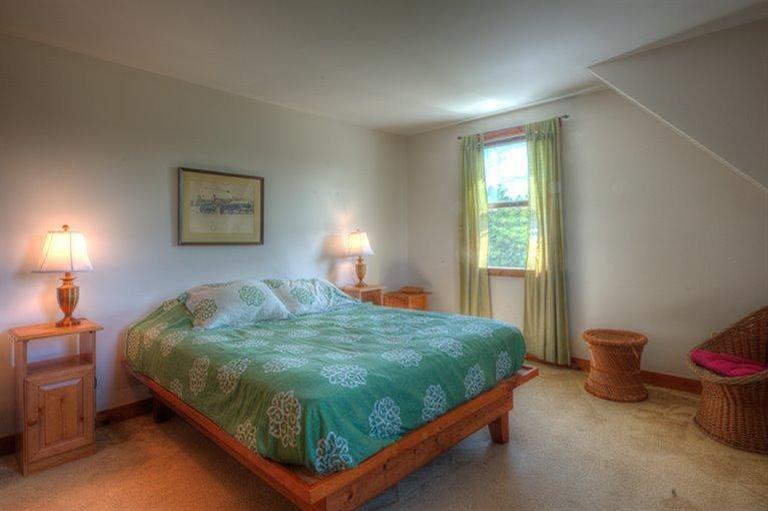 22 Knowles Heights Road Truro, MA 02666 - Photo 13 of 25 a bedroom with a bed and a window