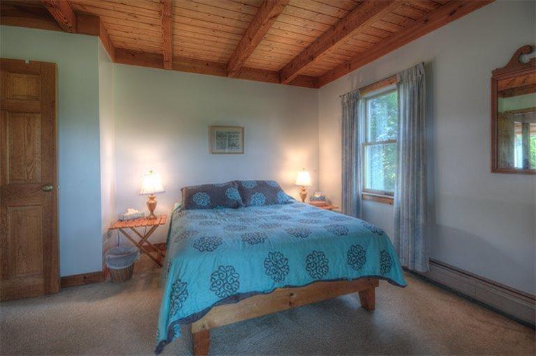 22 Knowles Heights Road Truro, MA 02666 - Photo 19 of 25 a bedroom with a bed and a window