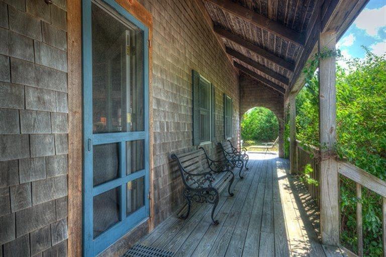 22 Knowles Heights Road Truro, MA 02666 - Photo 20 of 25 a view of balcony with chairs and wooden fence