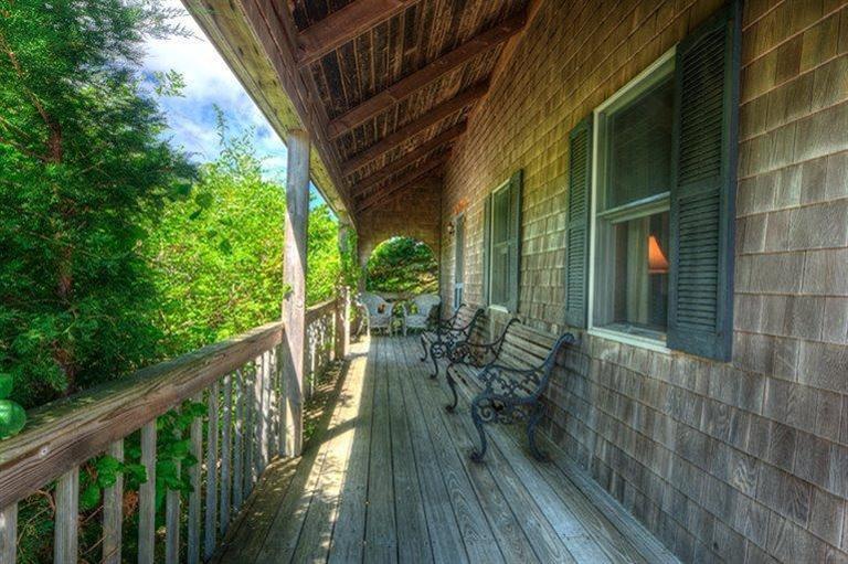 22 Knowles Heights Road Truro, MA 02666 - Photo 22 of 25 a view of balcony with chairs and wooden fence