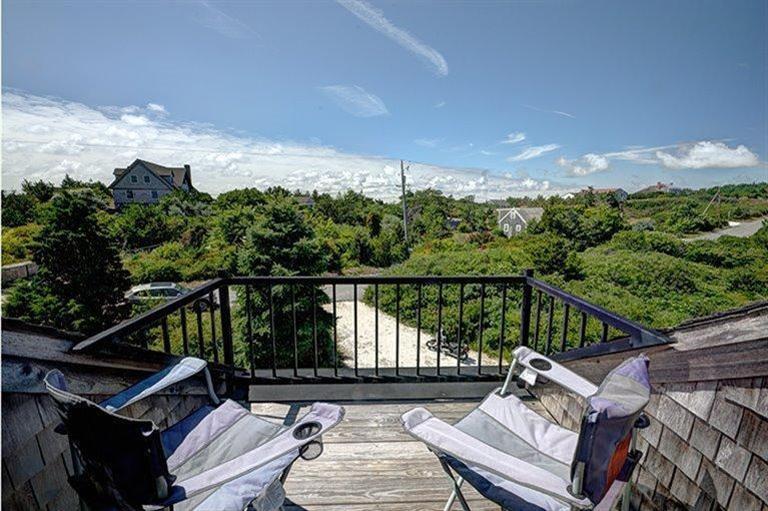 22 Knowles Heights Road Truro, MA 02666 - Photo 3 of 25 a view of a balcony with wooden floor and outdoor seating