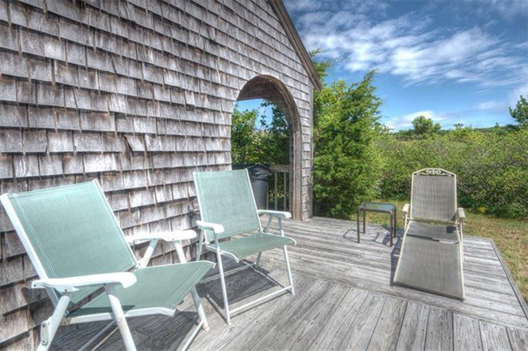 22 Knowles Heights Road Truro, MA 02666 - Photo 4 of 25 a view of a chairs with a table and chairs in patio