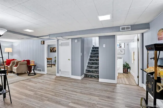 a view of a livingroom with furniture and wooden floor