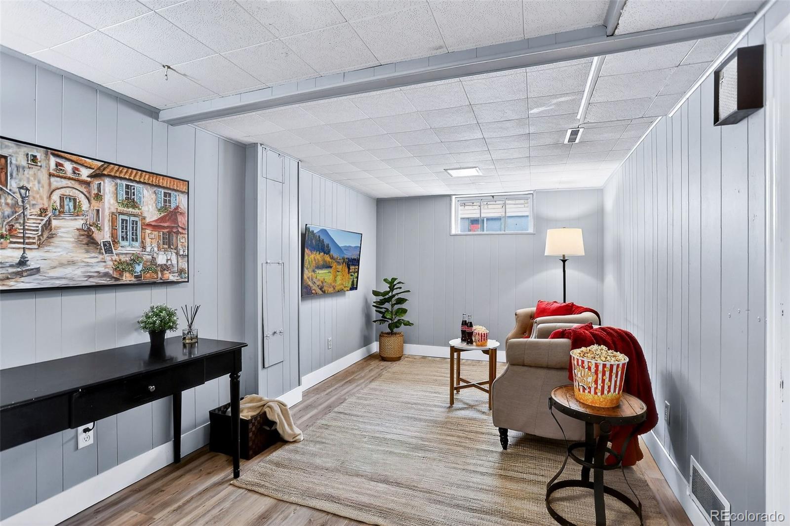 4185 Benton Street Denver, CO 80212 - Photo 23 of 40 a living room with furniture and wooden floor