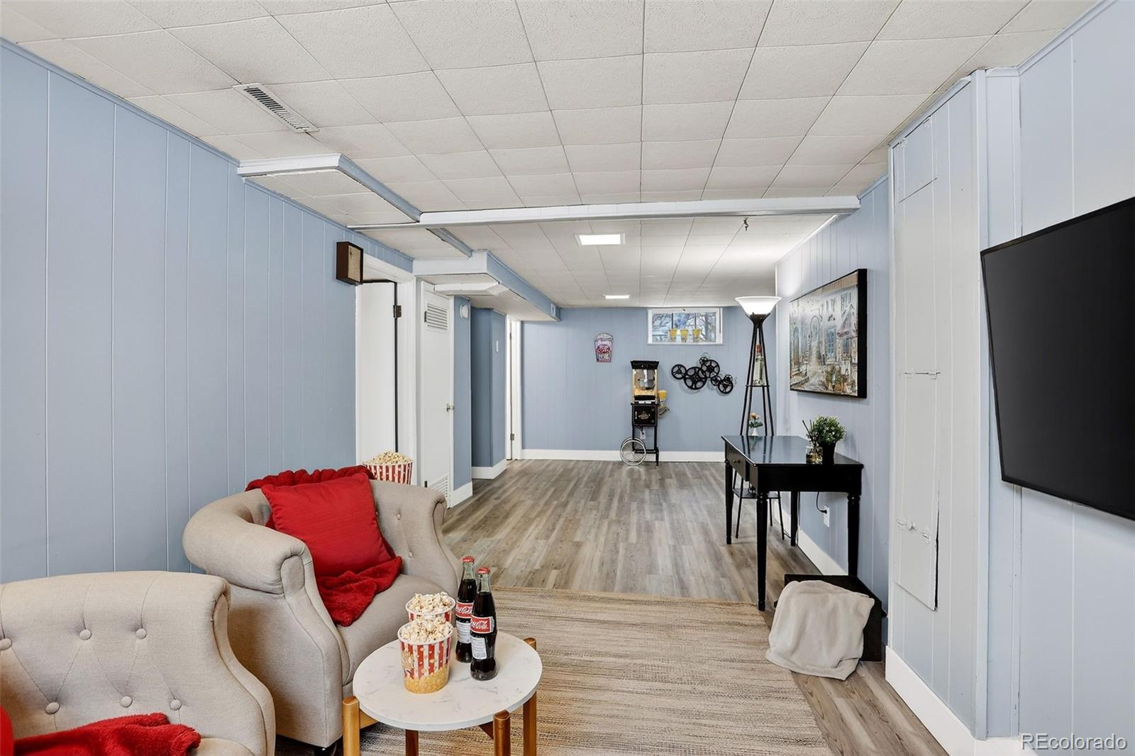 4185 Benton Street Denver, CO 80212 - Photo 24 of 40 a living room with furniture and a flat screen tv