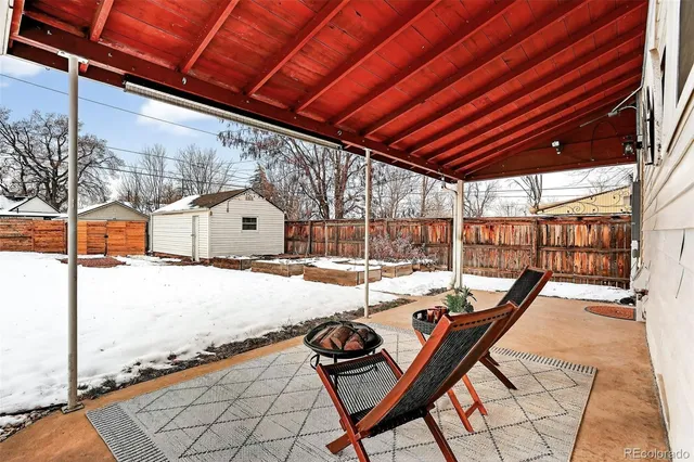 a view of a backyard with sitting area