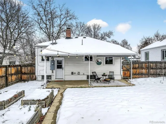 a front view of a house with sitting area and seating space