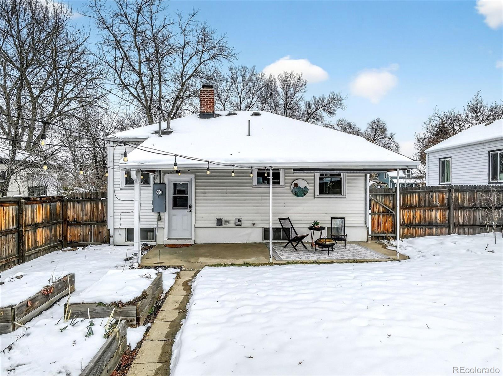 4185 Benton Street Denver, CO 80212 - Photo 32 of 40 a front view of a house with sitting area and seating space