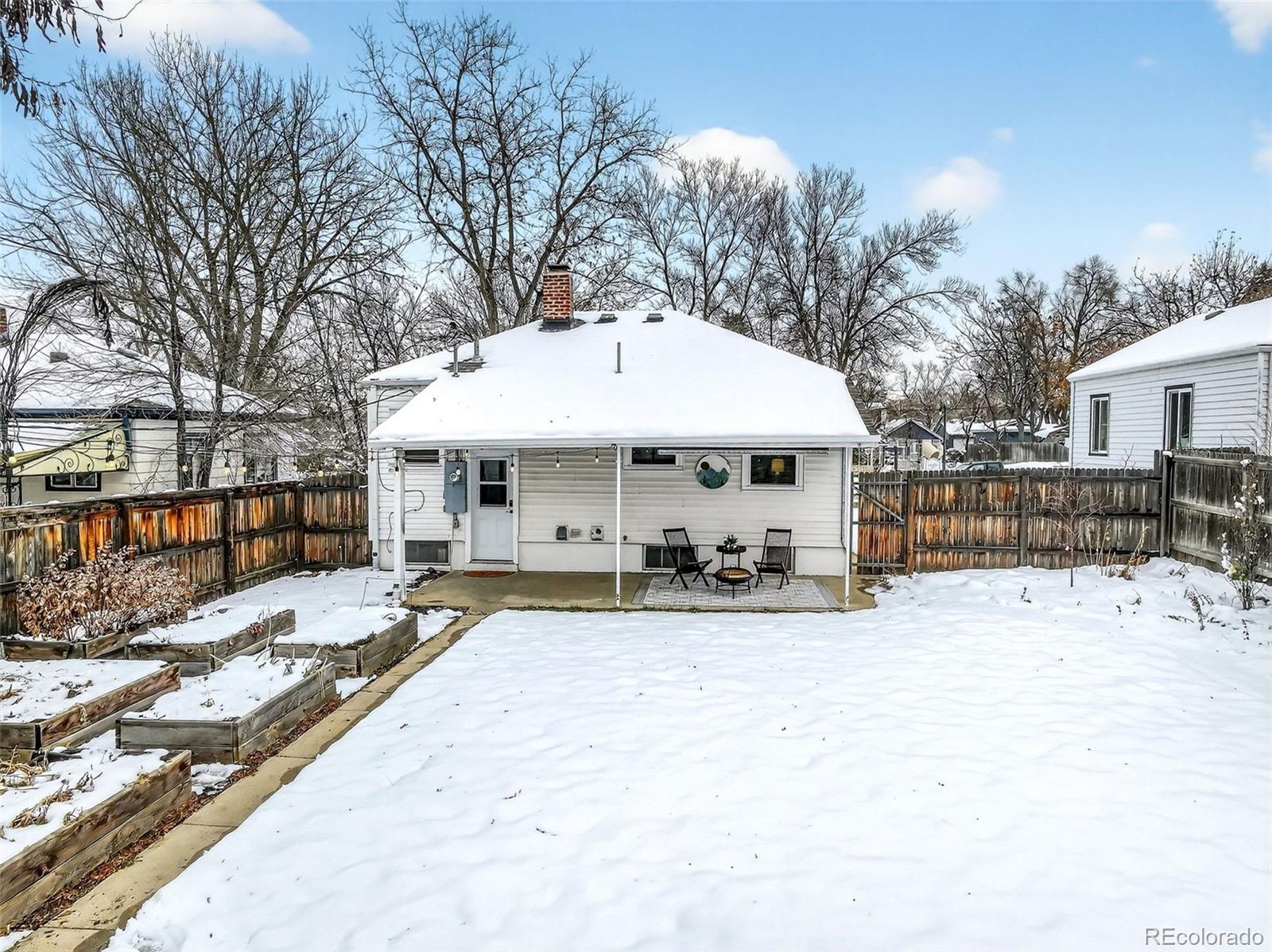 4185 Benton Street Denver, CO 80212 - Photo 33 of 40 a view of a dinning table and chairs in the patio