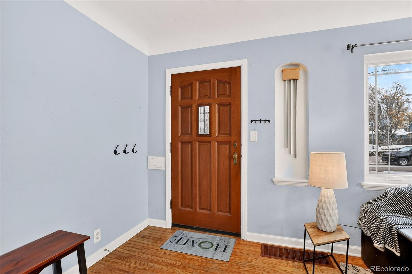 4185 Benton Street Denver, CO 80212 - Photo 6 of 40 a view of a bedroom with furniture and wooden floor