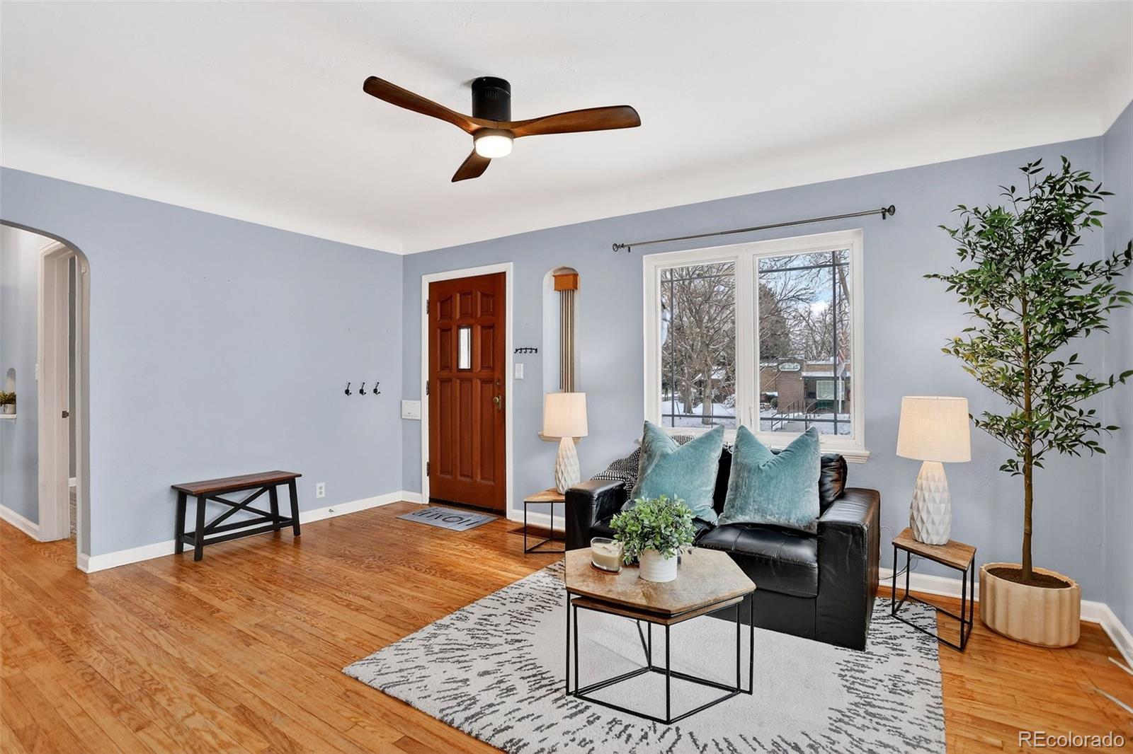 4185 Benton Street Denver, CO 80212 - Photo 10 of 40 a living room with furniture and a wooden floor