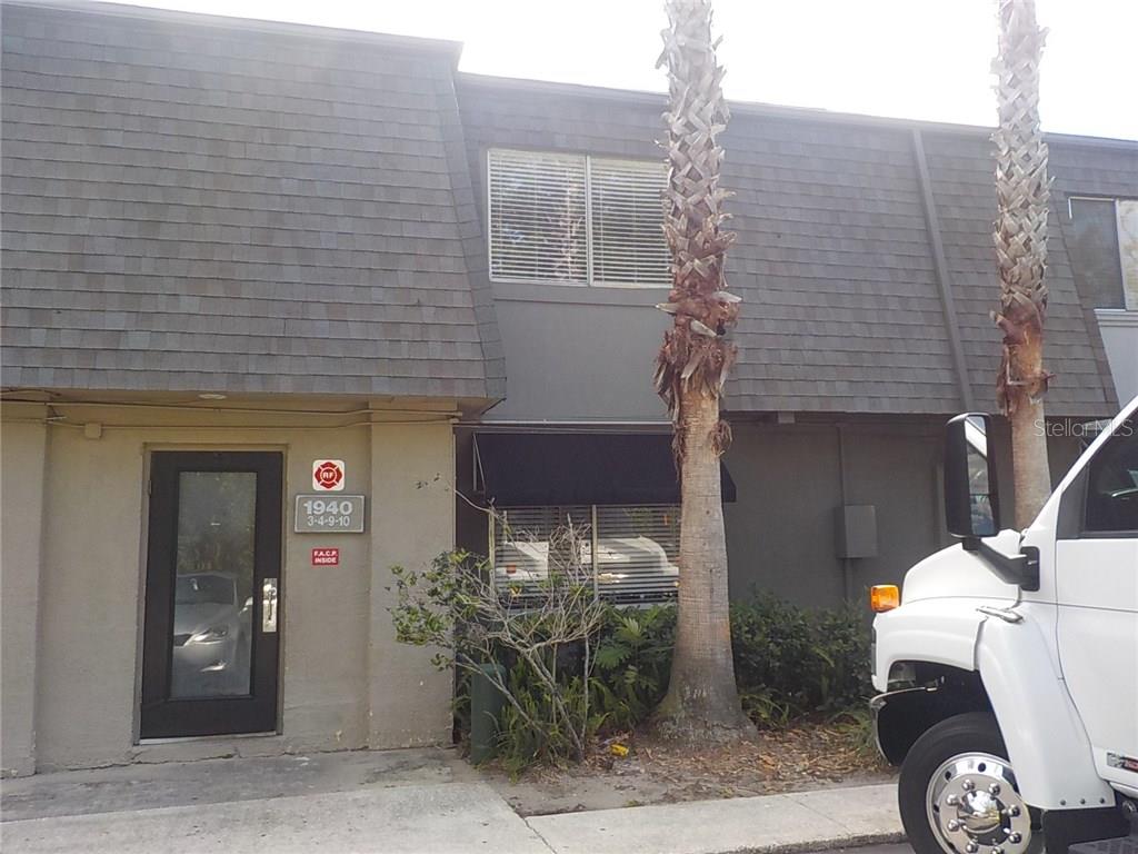 1940 South Conway Road, Unit 9 Orlando, FL 32812 - Photo 1 of 1 a front view of a house with outdoor seating