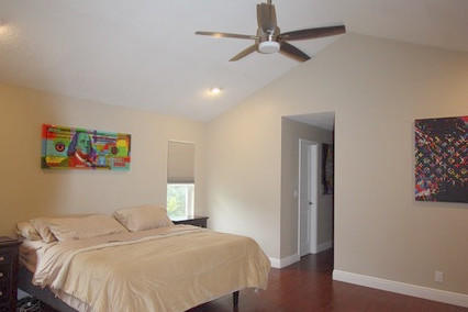 2541 Northwest 39th Street Boca Raton, FL 33434 - Photo 11 of 22 a bedroom with a bed and a window