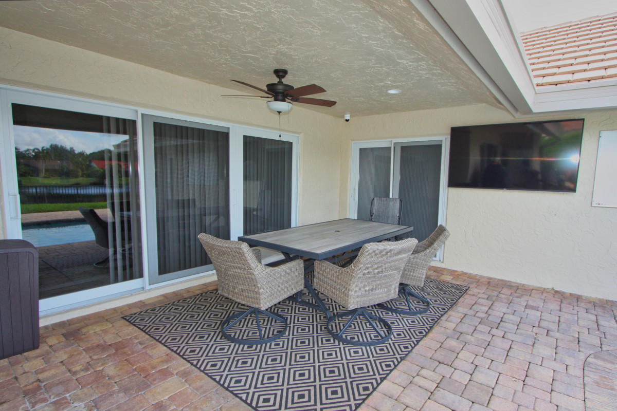 2541 Northwest 39th Street Boca Raton, FL 33434 - Photo 14 of 22 a view of a livingroom with furniture and a ceiling fan