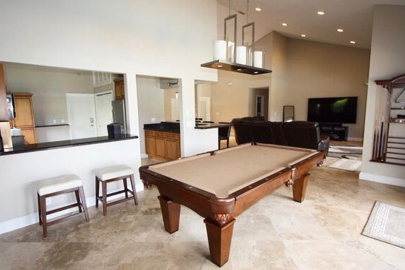 2541 Northwest 39th Street Boca Raton, FL 33434 - Photo 8 of 22 a living room with furniture a table and kitchen view