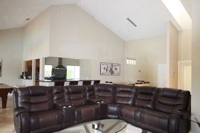 2541 Northwest 39th Street Boca Raton, FL 33434 - Photo 9 of 22 a projector room with a couch