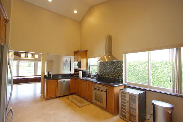 2541 Northwest 39th Street Boca Raton, FL 33434 - Photo 10 of 22 a kitchen with stainless steel appliances granite countertop a stove and a sink