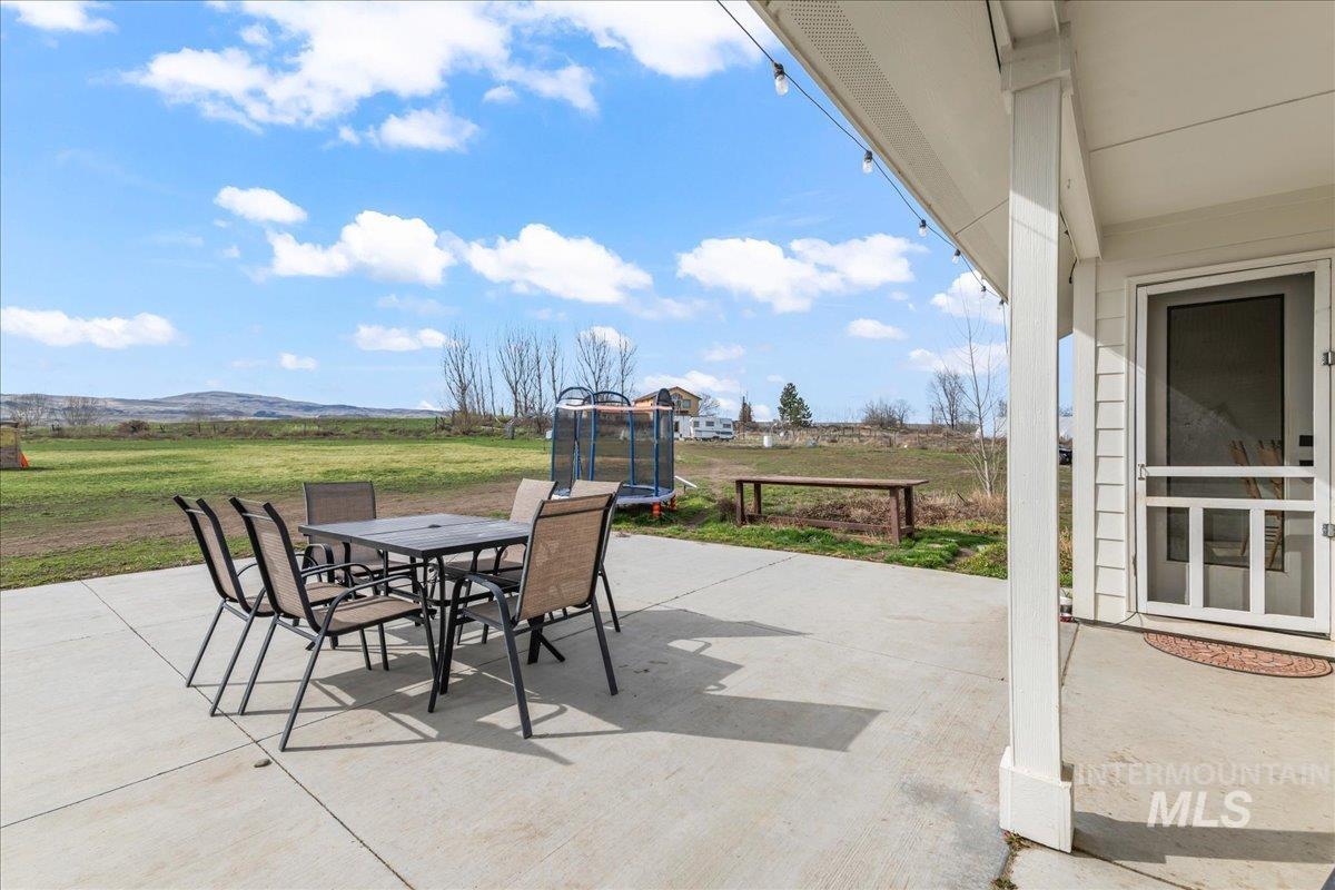 8843 Highway 78 Marsing, ID 83639 - Photo 35 of 48 View of patio / terrace with a trampoline and outdoor dining space