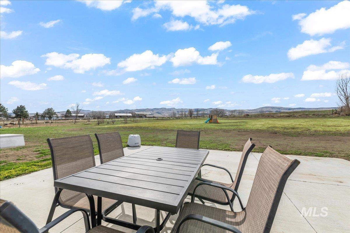 8843 Highway 78 Marsing, ID 83639 - Photo 36 of 48 View of patio featuring outdoor dining space and a mountain view