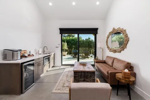 a view of a house with a yard porch and sitting area