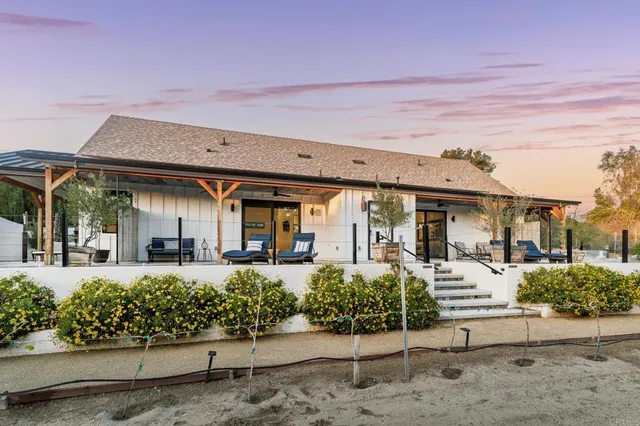 a bedroom with a bed and a large mirror