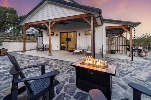 a view of a chairs and tables in patio