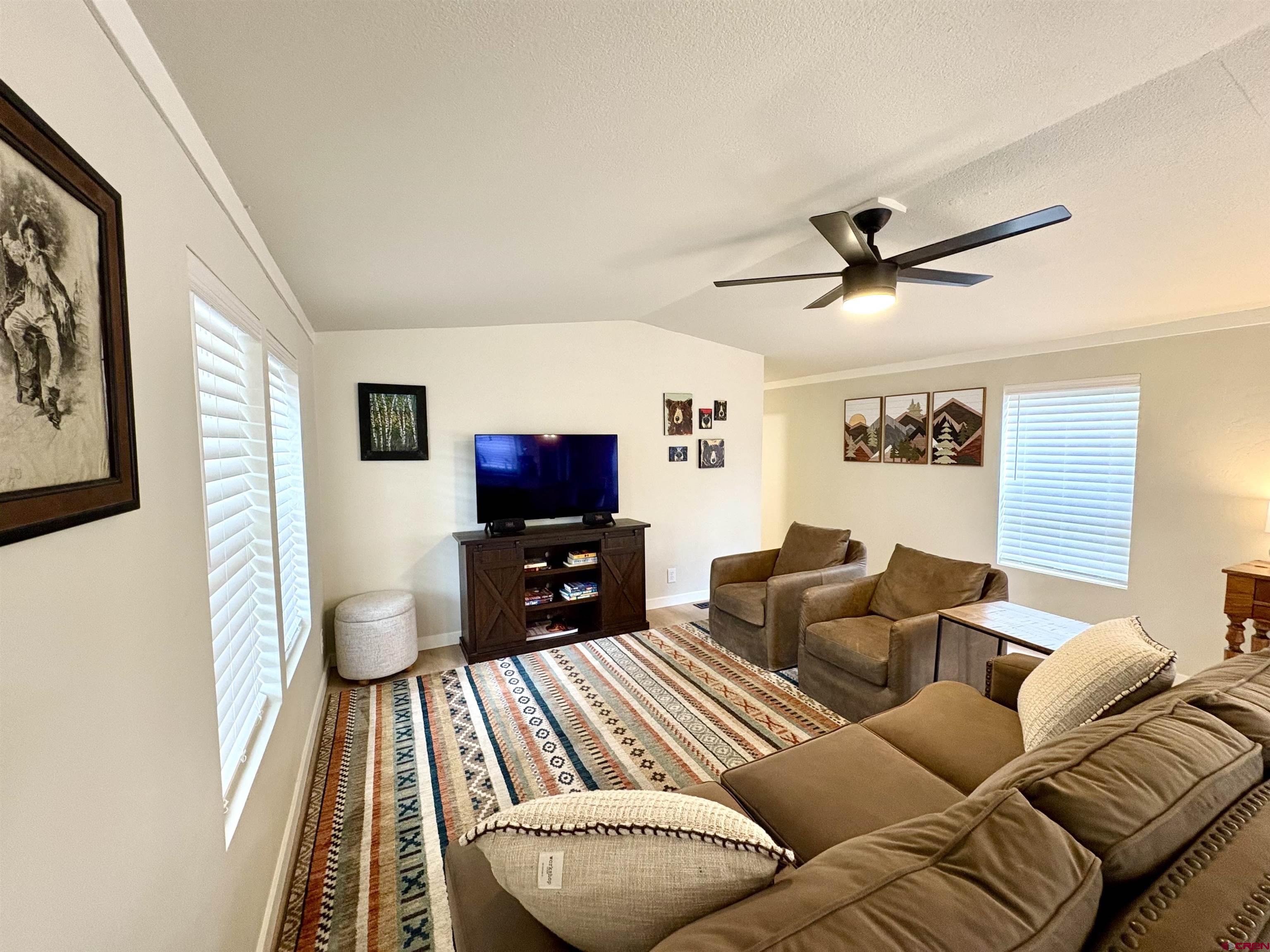 288 Animas View Drive, Unit 11 Durango, CO 81301 - Photo 12 of 23 a living room with furniture a flat screen tv and a window