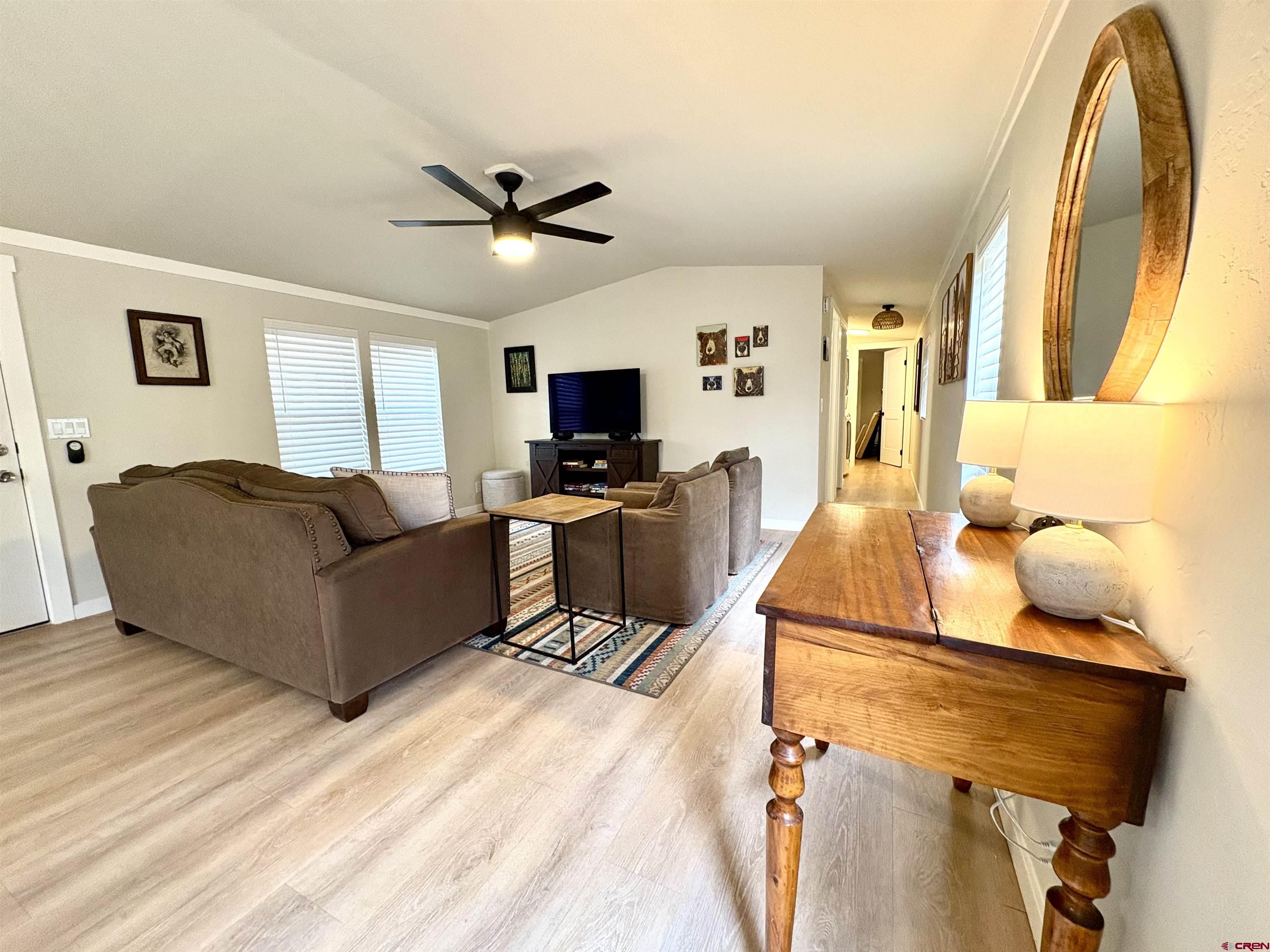 288 Animas View Drive, Unit 11 Durango, CO 81301 - Photo 13 of 23 a living room with furniture and a flat screen tv