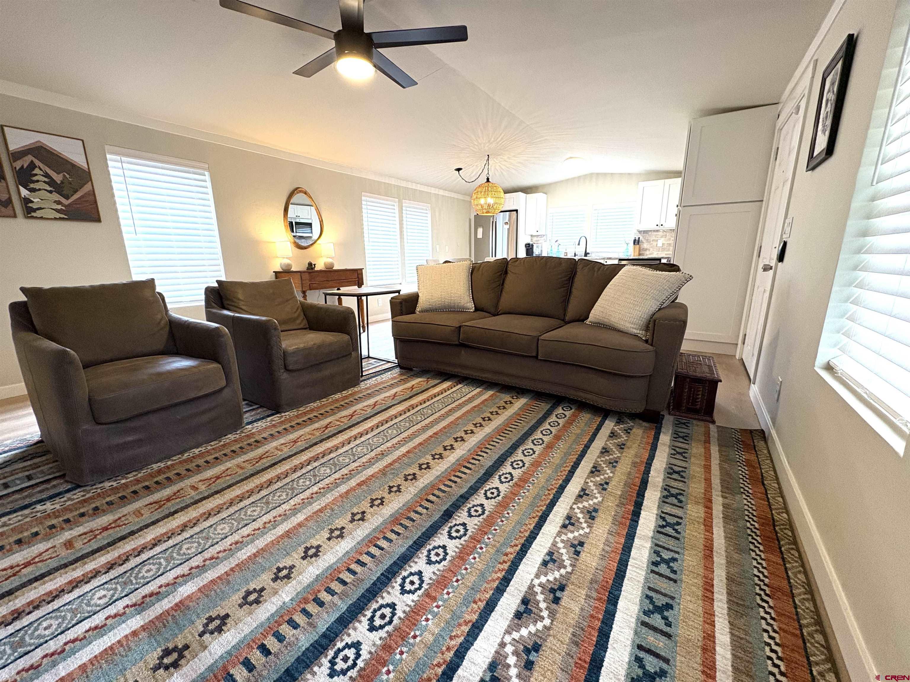 288 Animas View Drive, Unit 11 Durango, CO 81301 - Photo 15 of 23 a living room with furniture a rug and a rug