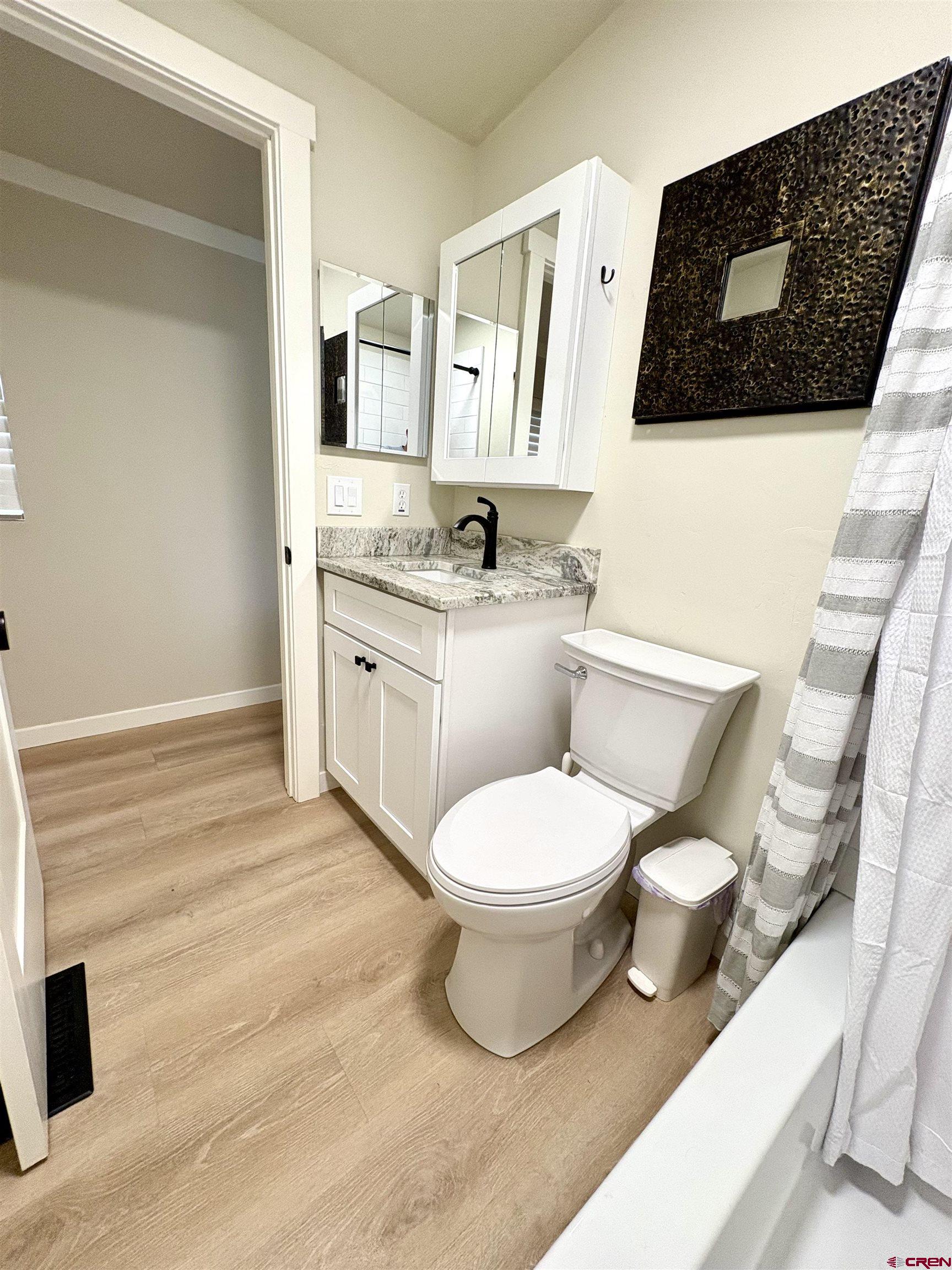 288 Animas View Drive, Unit 11 Durango, CO 81301 - Photo 22 of 23 a bathroom with a toilet a sink and mirror