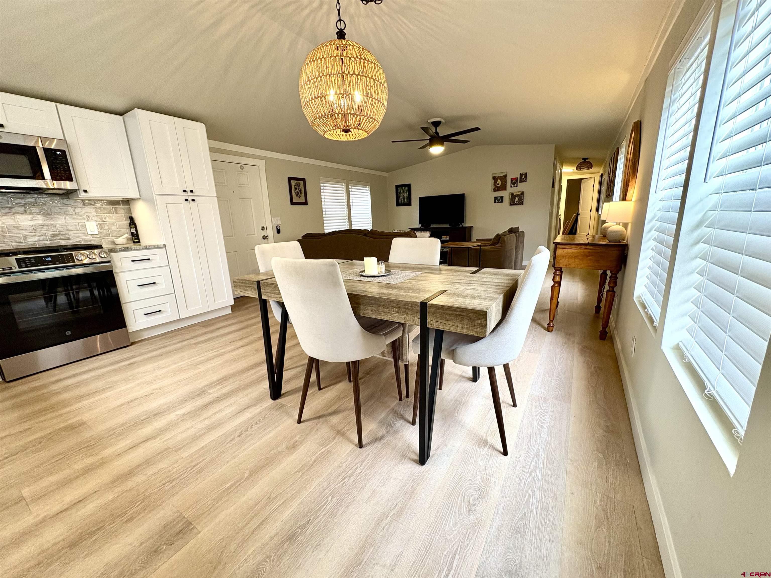 288 Animas View Drive, Unit 11 Durango, CO 81301 - Photo 9 of 23 a view of a dining room with furniture window and wooden floor
