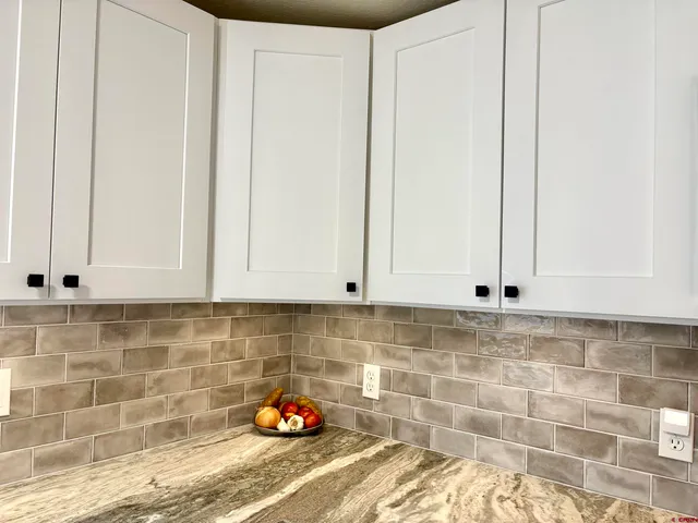 a kitchen with stainless steel appliances granite countertop a refrigerator sink and cabinets