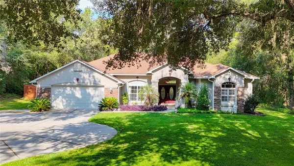 front view of a house with a yard