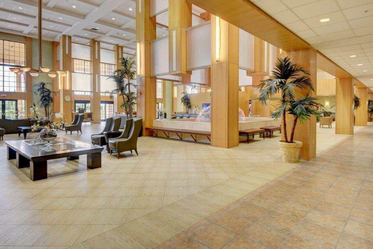 104 Mansfield C, Unit C Boca Raton, FL 33434 - Photo 20 of 40 a living room with fireplace furniture and a large window