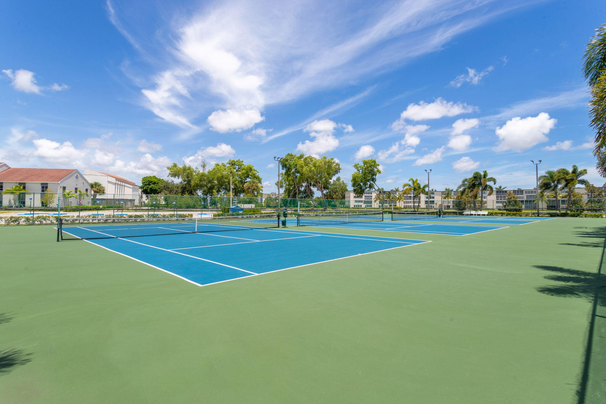 104 Mansfield C, Unit C Boca Raton, FL 33434 - Photo 30 of 40 a view of an outdoor space and tennis court