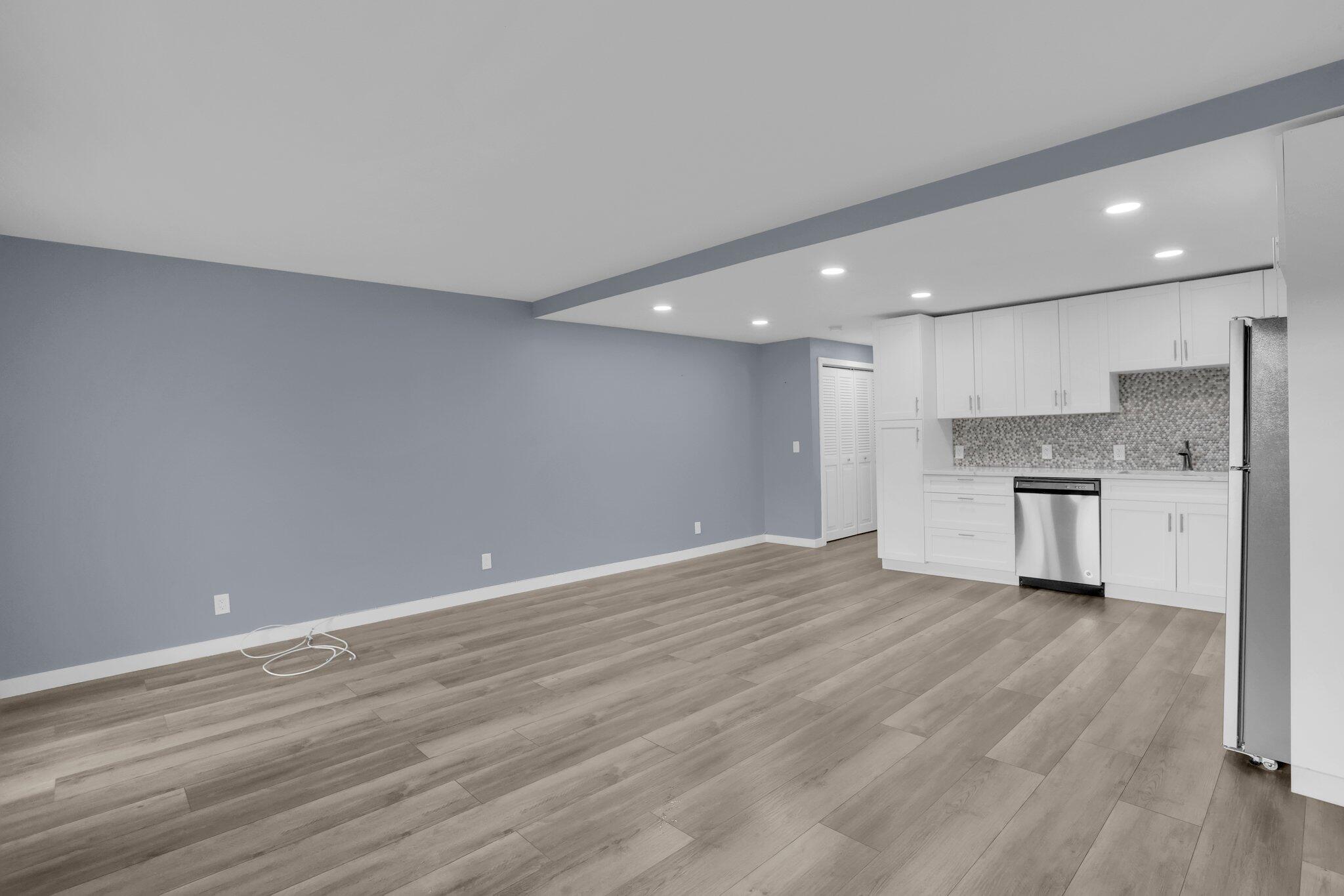 104 Mansfield C, Unit C Boca Raton, FL 33434 - Photo 8 of 40 a view of kitchen with wooden floor