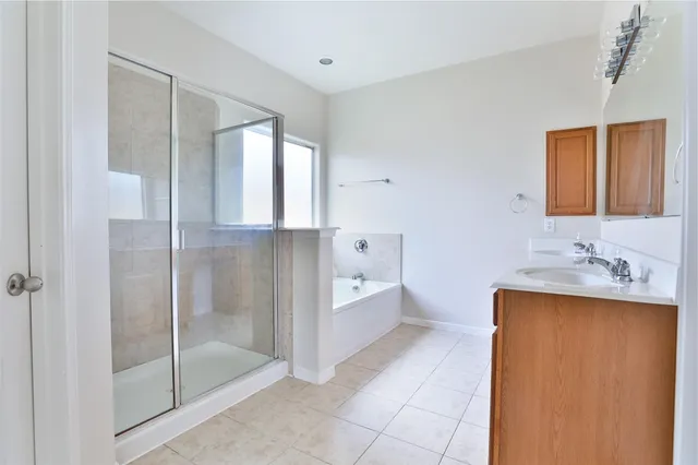a kitchen with a sink cabinets and a window