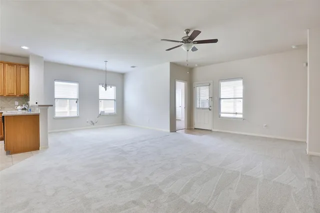 a view of a kitchen with closet and a window