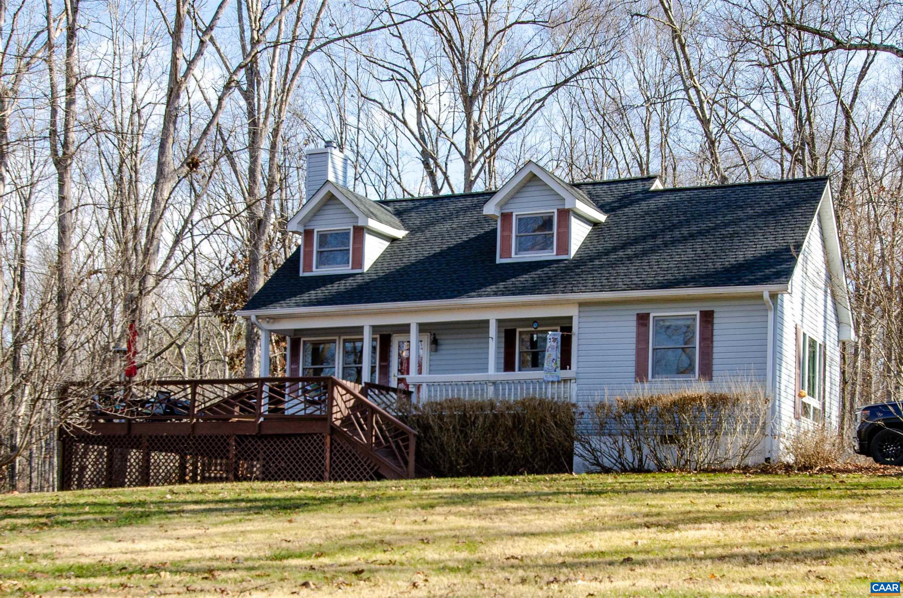 1709 Courthouse Road Palmyra, VA 22963 - Photo 1 of 59 a front view of a house with a yard table and chairs