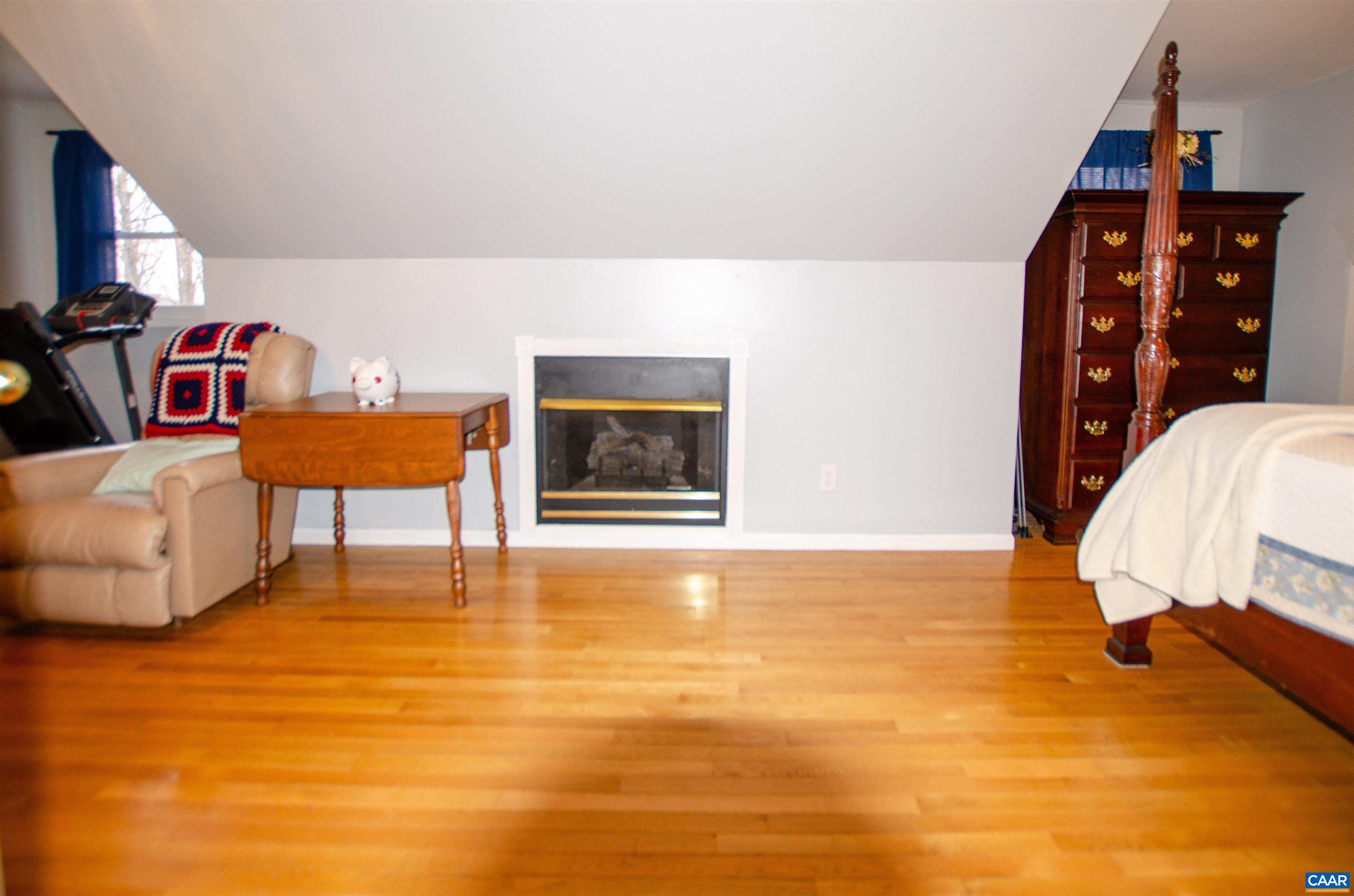 1709 Courthouse Road Palmyra, VA 22963 - Photo 24 of 59 a living room with furniture and a flat screen tv