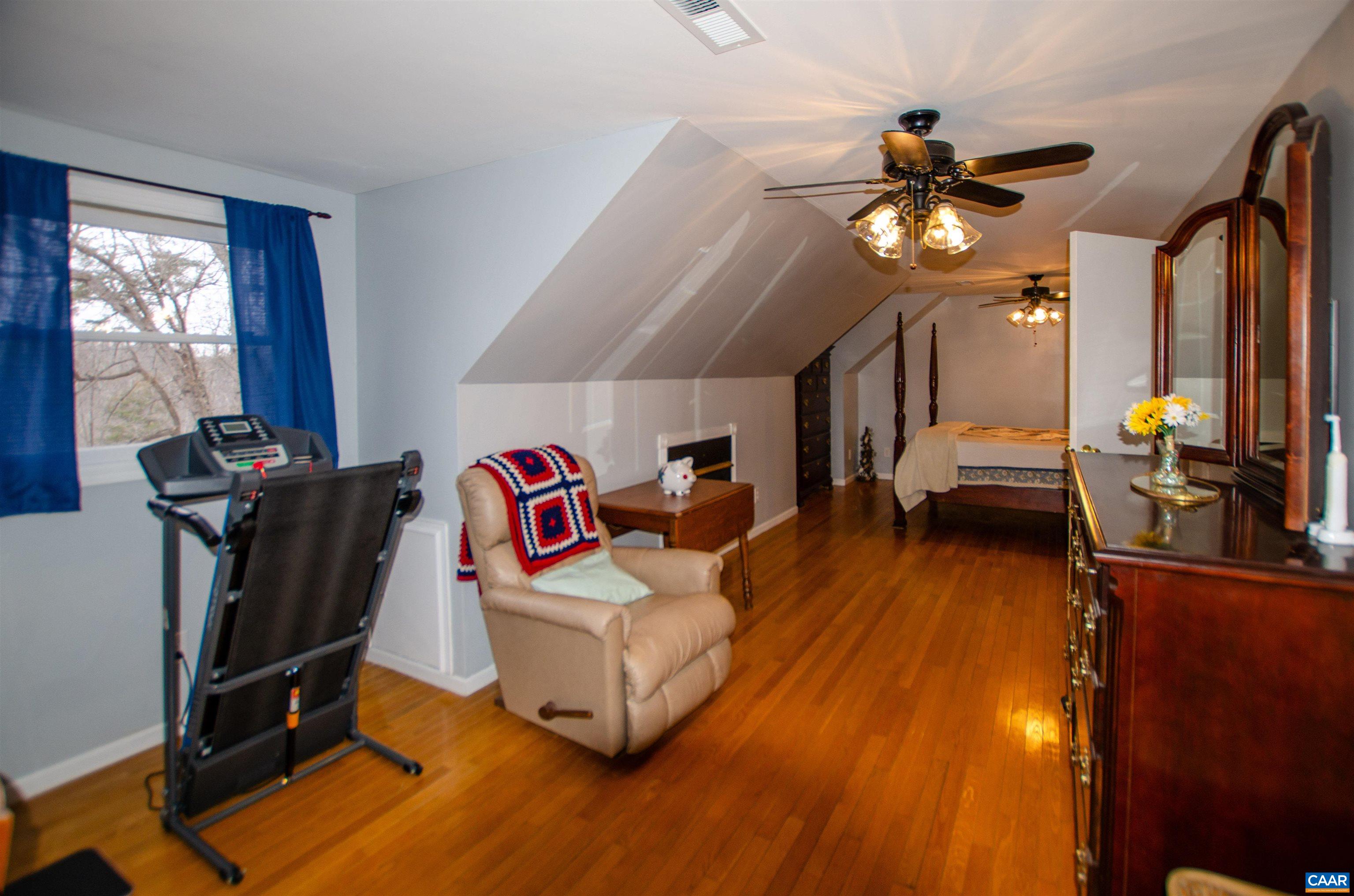 1709 Courthouse Road Palmyra, VA 22963 - Photo 26 of 59 a living room with furniture a flat screen tv and a window