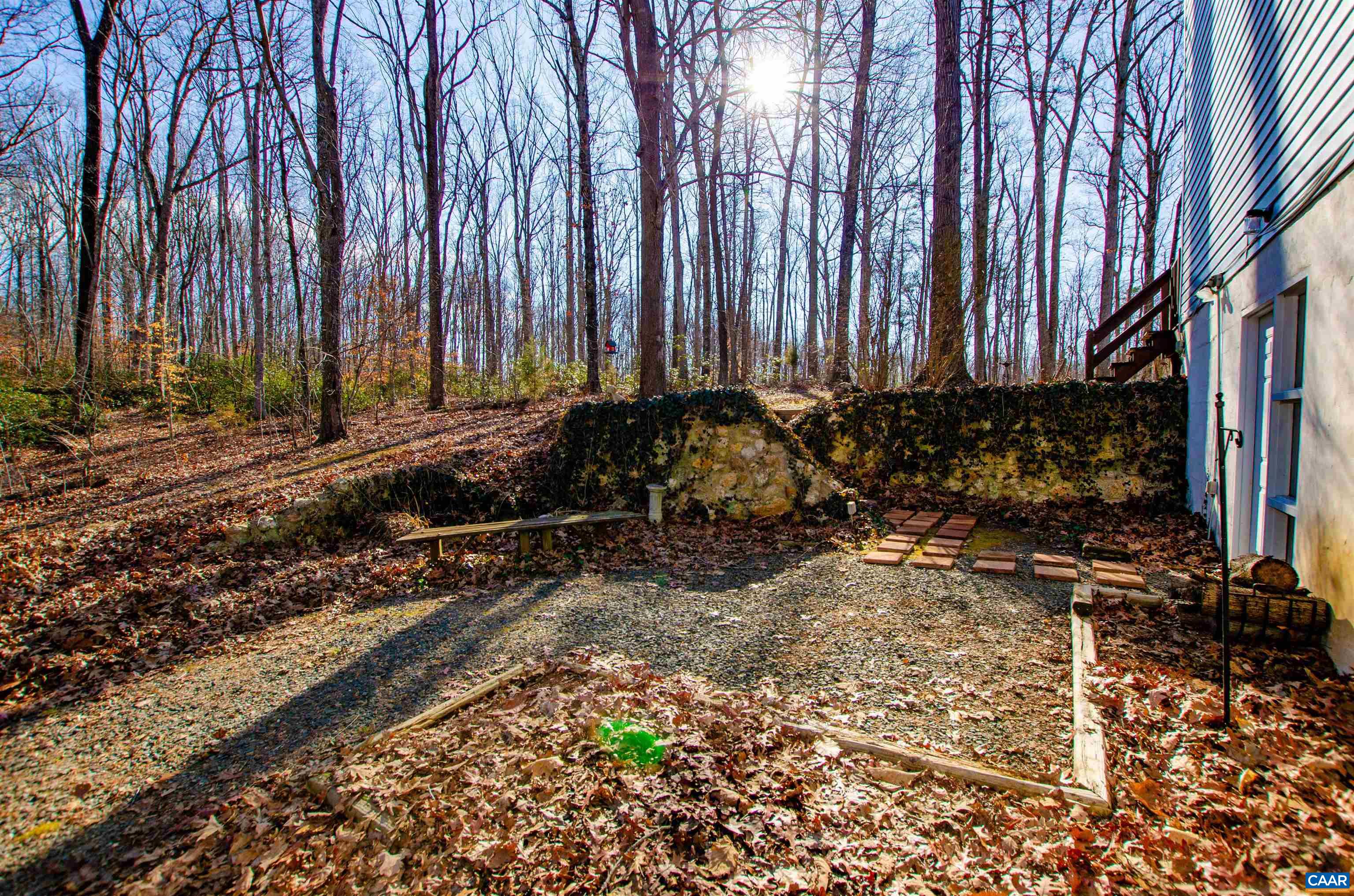 1709 Courthouse Road Palmyra, VA 22963 - Photo 42 of 59 a view of a backyard with potted plants and large trees